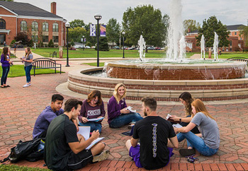 Students Studying Outside Around the Fountain