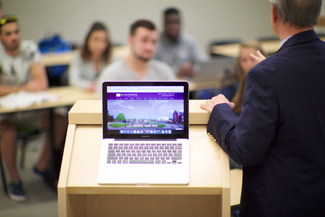 Photo of Professor Instructing in Front of Class