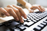 Photo of Person Typing on Keyboard