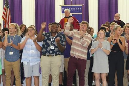 New students sing the university fight song during the Convocation on Aug. 21.